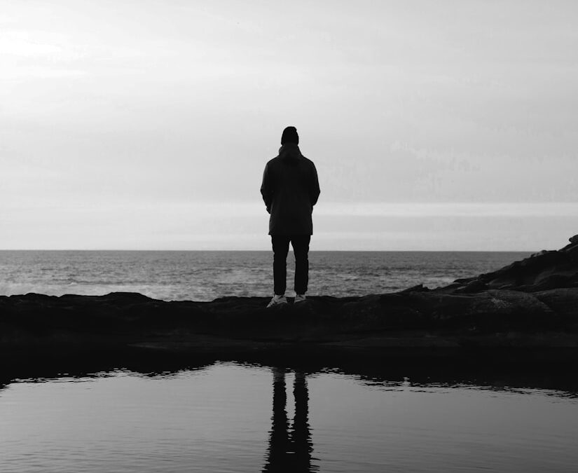 person standing in front of sea