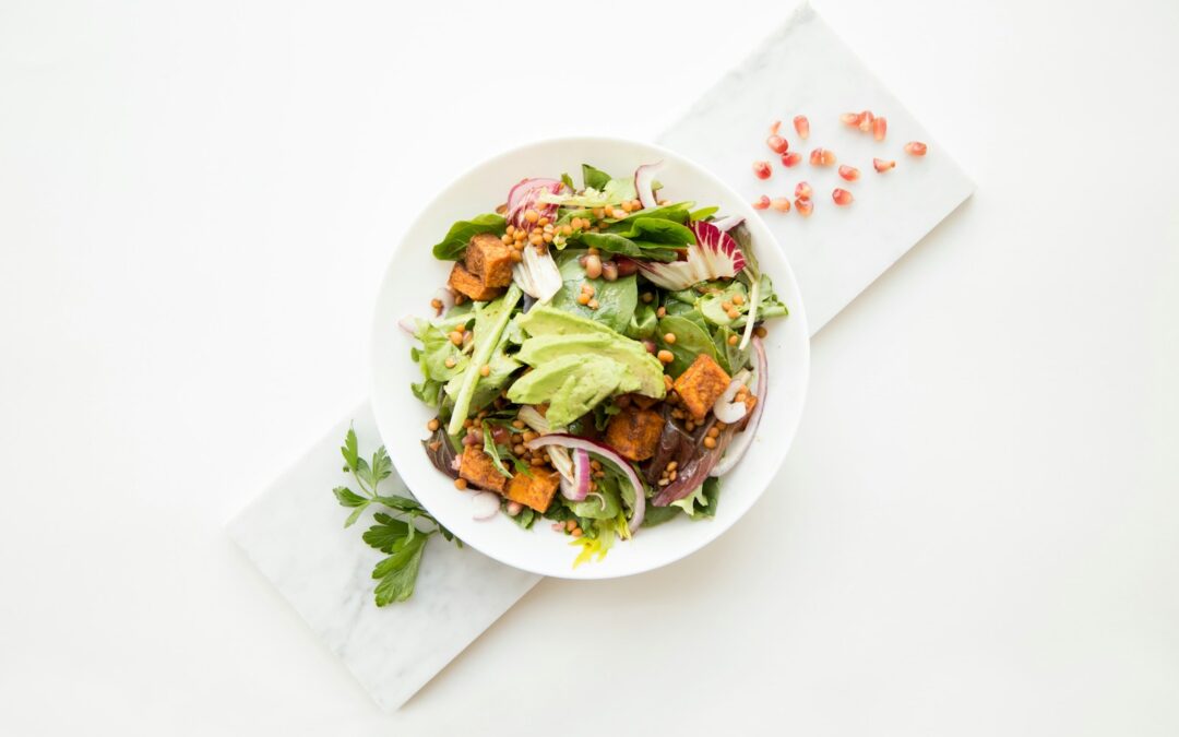 cooked food with sliced vegetables in white bowl