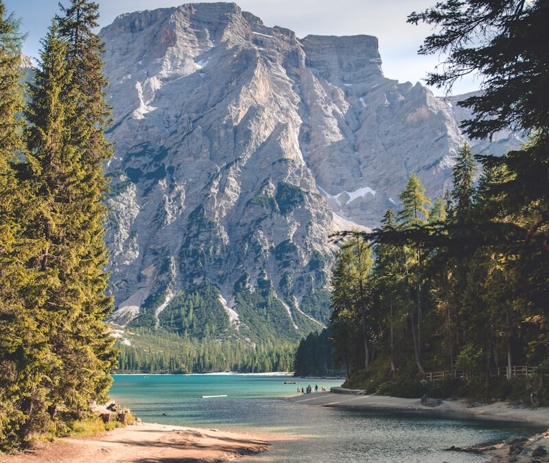 white mountain near body of water